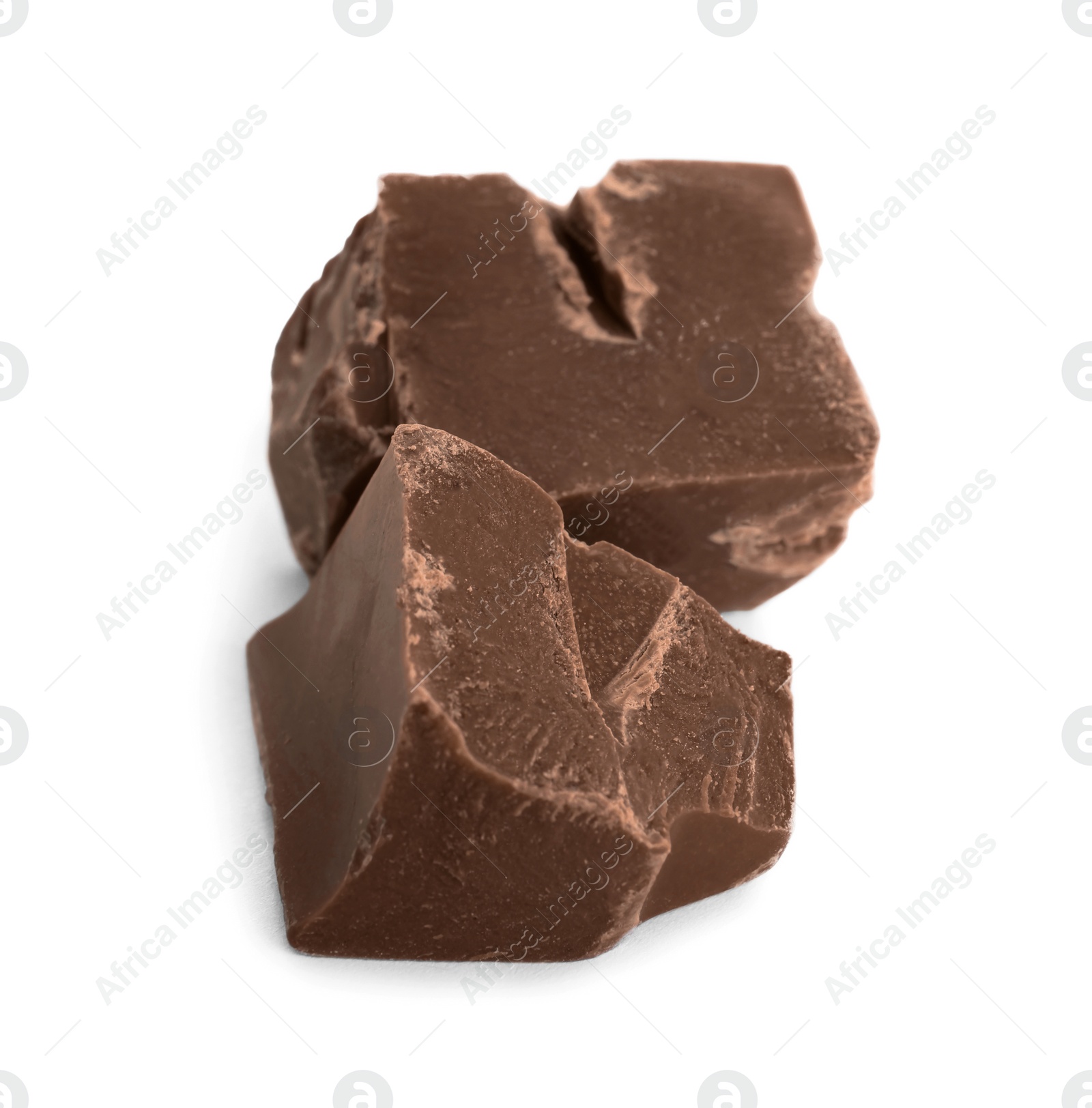 Photo of Pieces of milk chocolate isolated on white