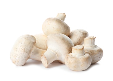 Photo of Fresh champignon mushrooms isolated on white. Healthy food