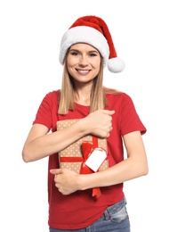 Photo of Young woman with Christmas gift on white background