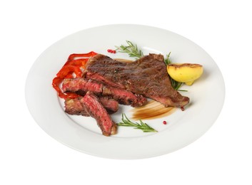 Photo of Delicious grilled beef steak with pepper, spices and lemon isolated on white