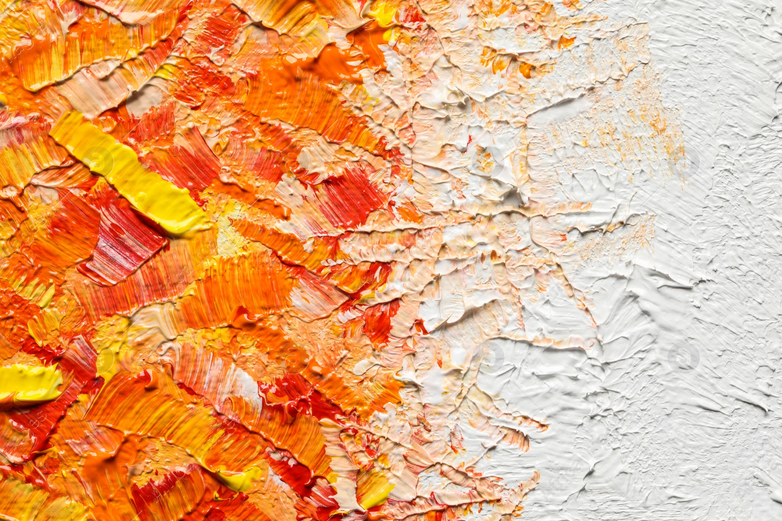 Photo of Beautiful strokes of colorful oil paints as background, closeup