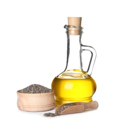 Composition with jug of chia oil and seeds on white background