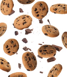 Image of Delicious chocolate chip cookies and pieces of chocolate falling on white background