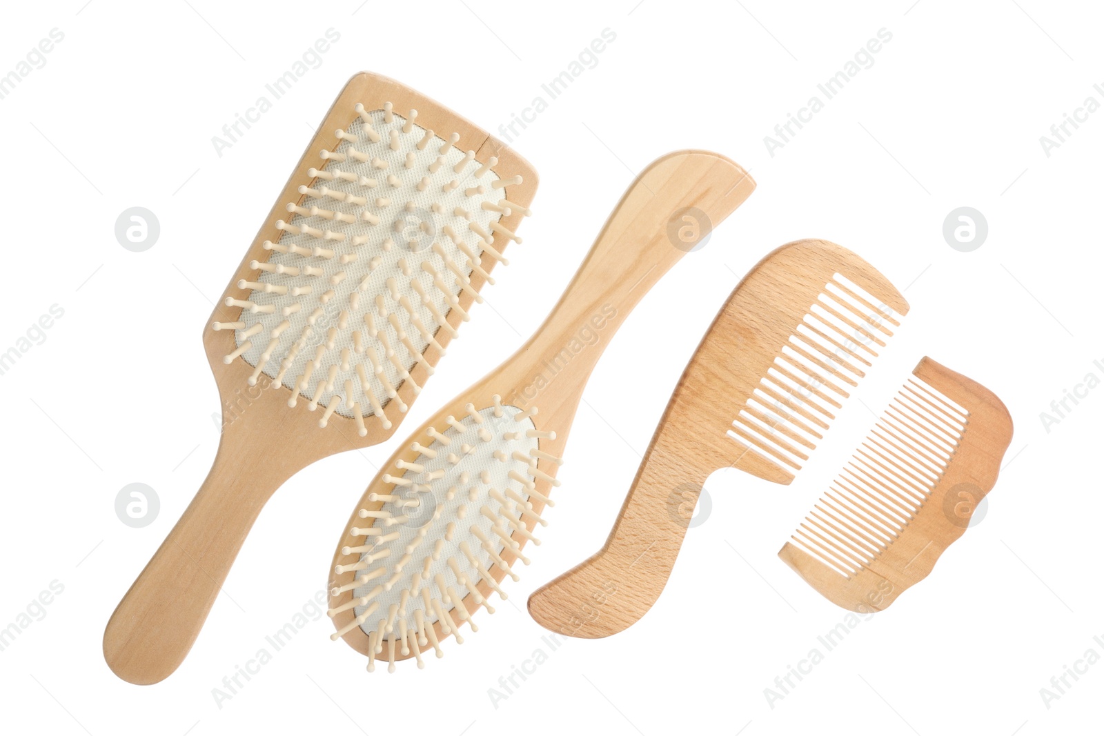 Photo of Different wooden hair brushes and combs on white background, top view
