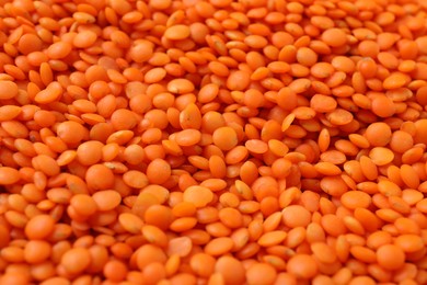 Photo of Heap of raw lentils as background, closeup view
