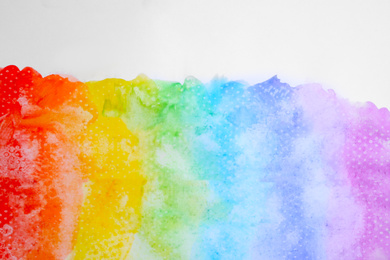 Paint brush strokes on white background, top view. Rainbow colors