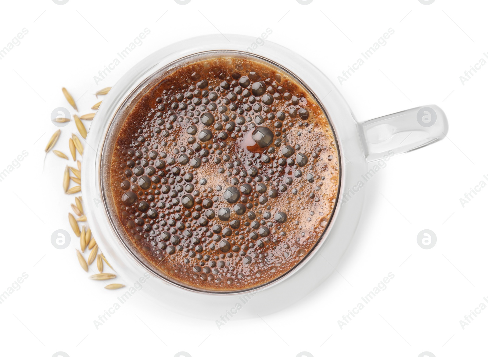 Photo of Cup of barley coffee and grains isolated on white, top view