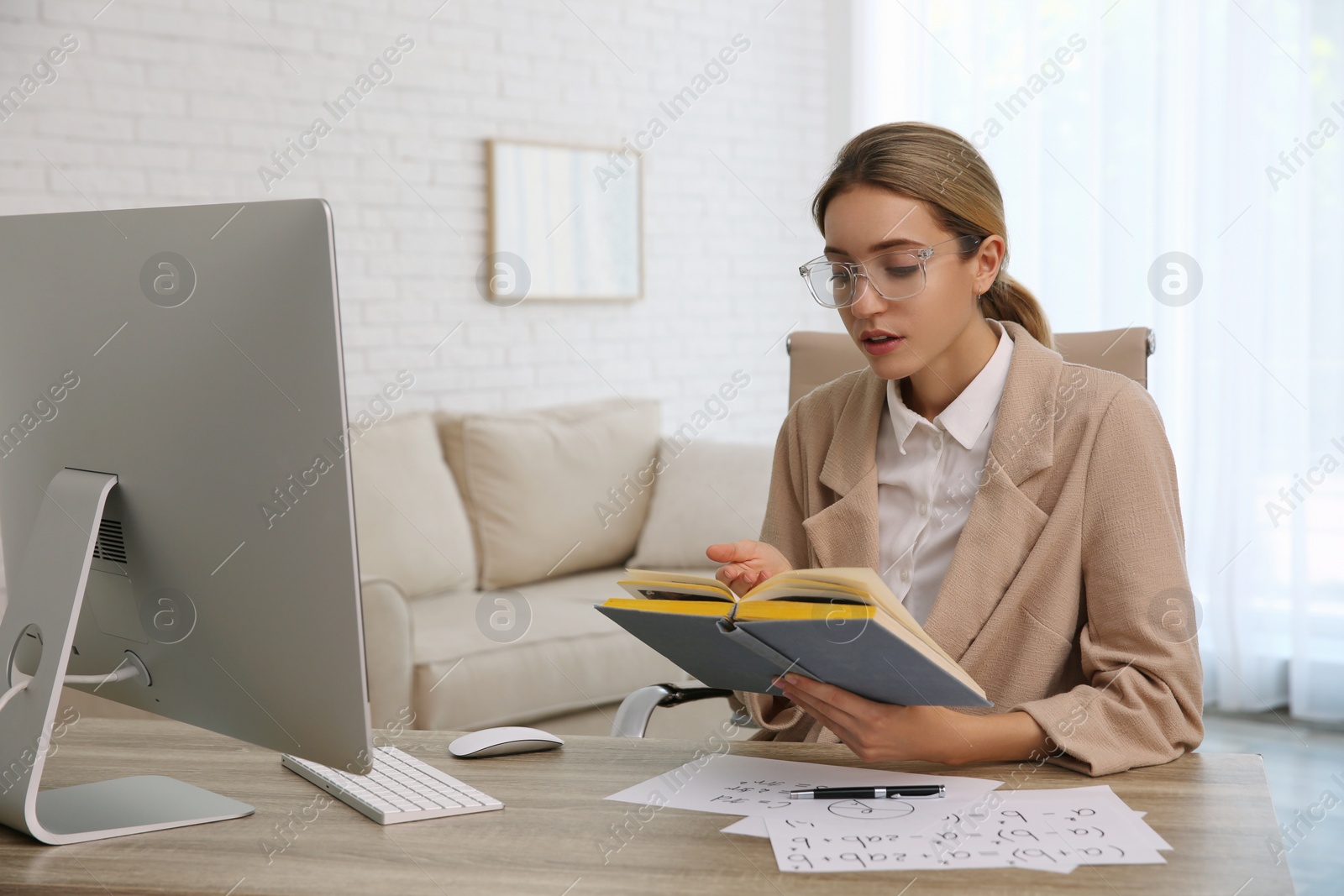 Photo of Teacher giving online school lesson. Distance learning during coronavirus quarantine, study at home