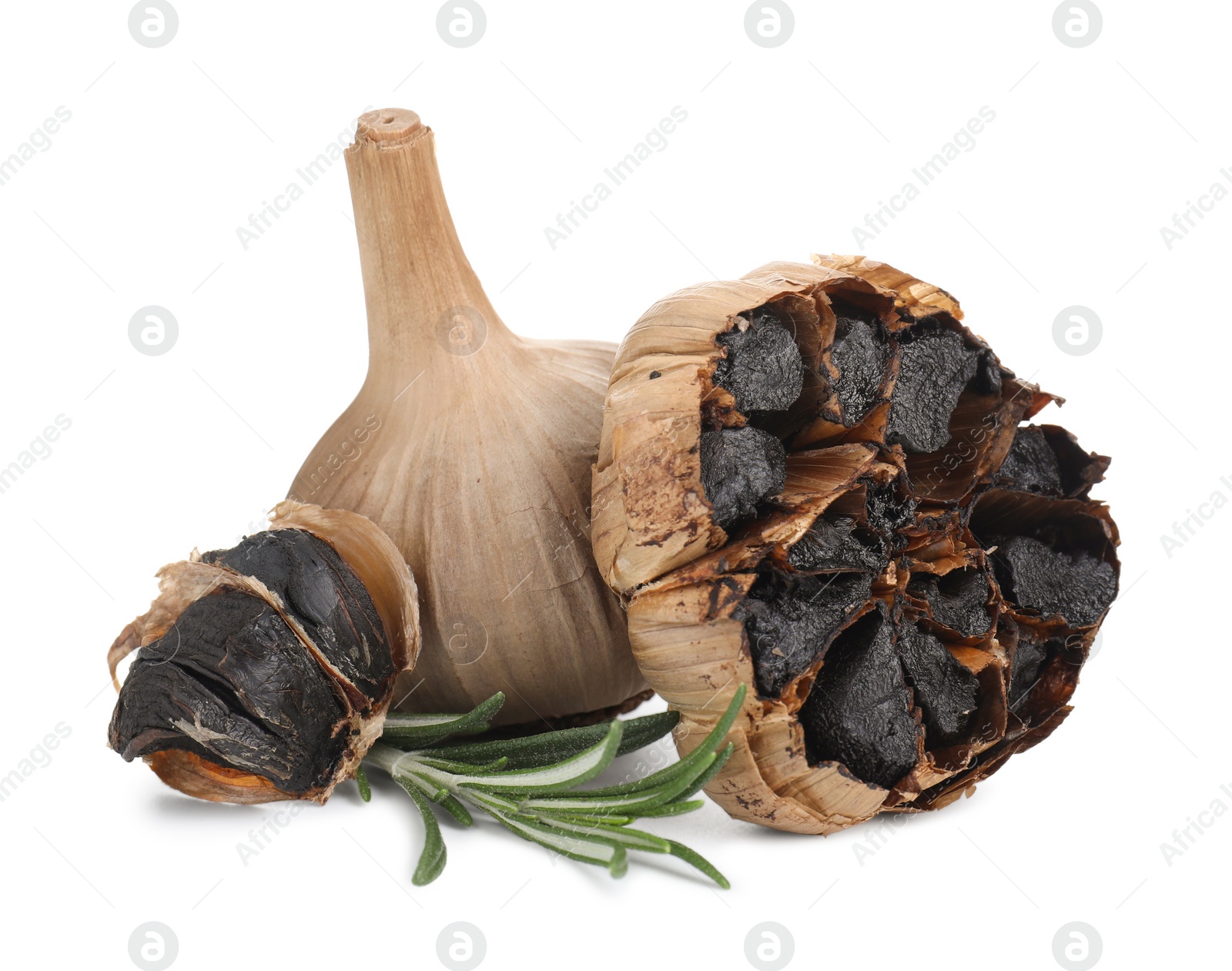 Photo of Fermented black garlic and rosemary isolated on white