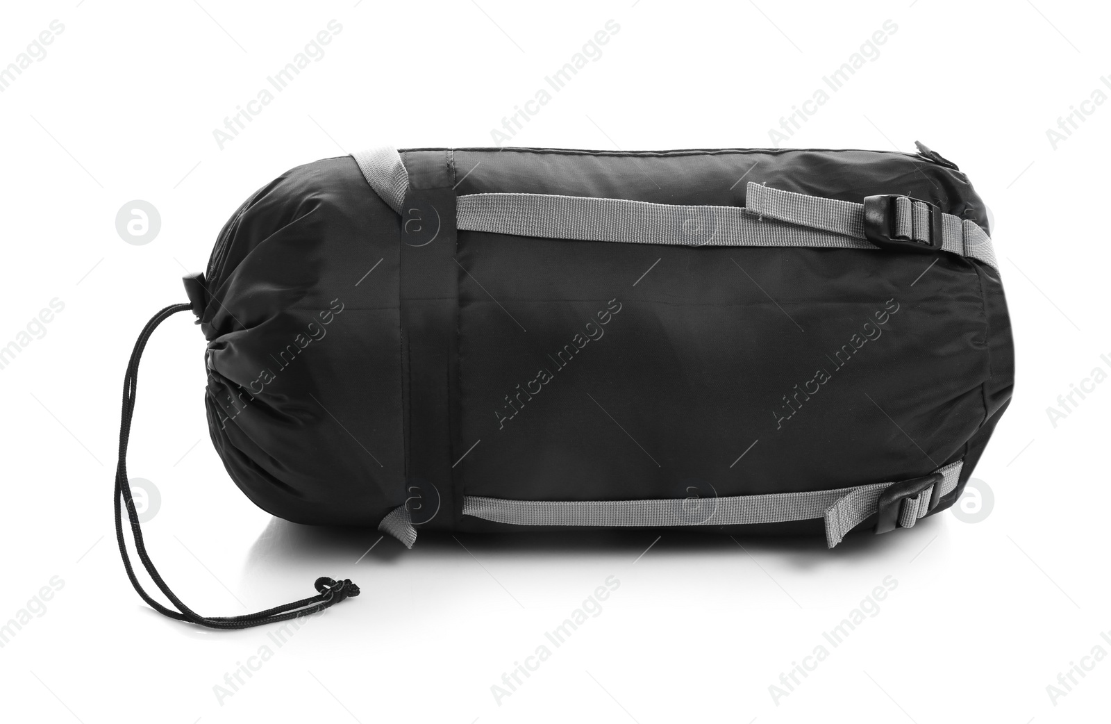 Photo of Sleeping bag in case on white background. Camping equipment