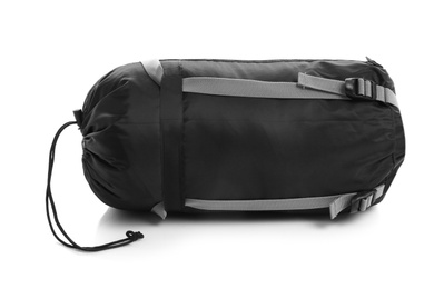 Photo of Sleeping bag in case on white background. Camping equipment