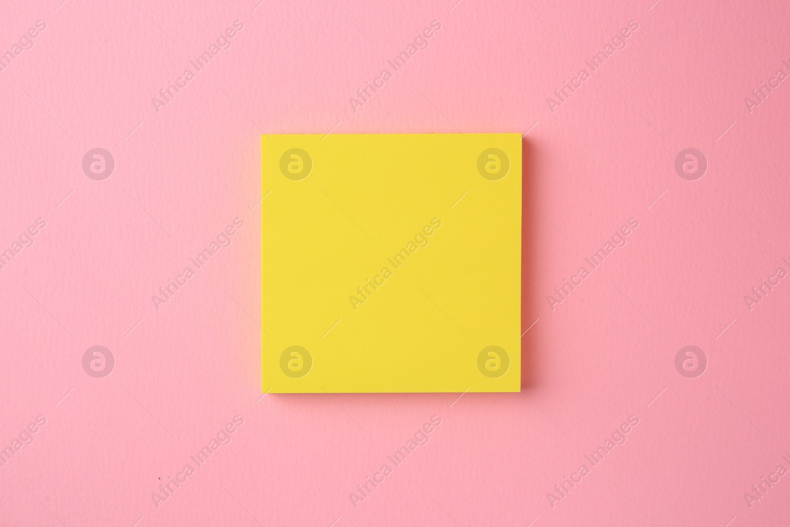 Photo of Blank paper note on pink background, top view