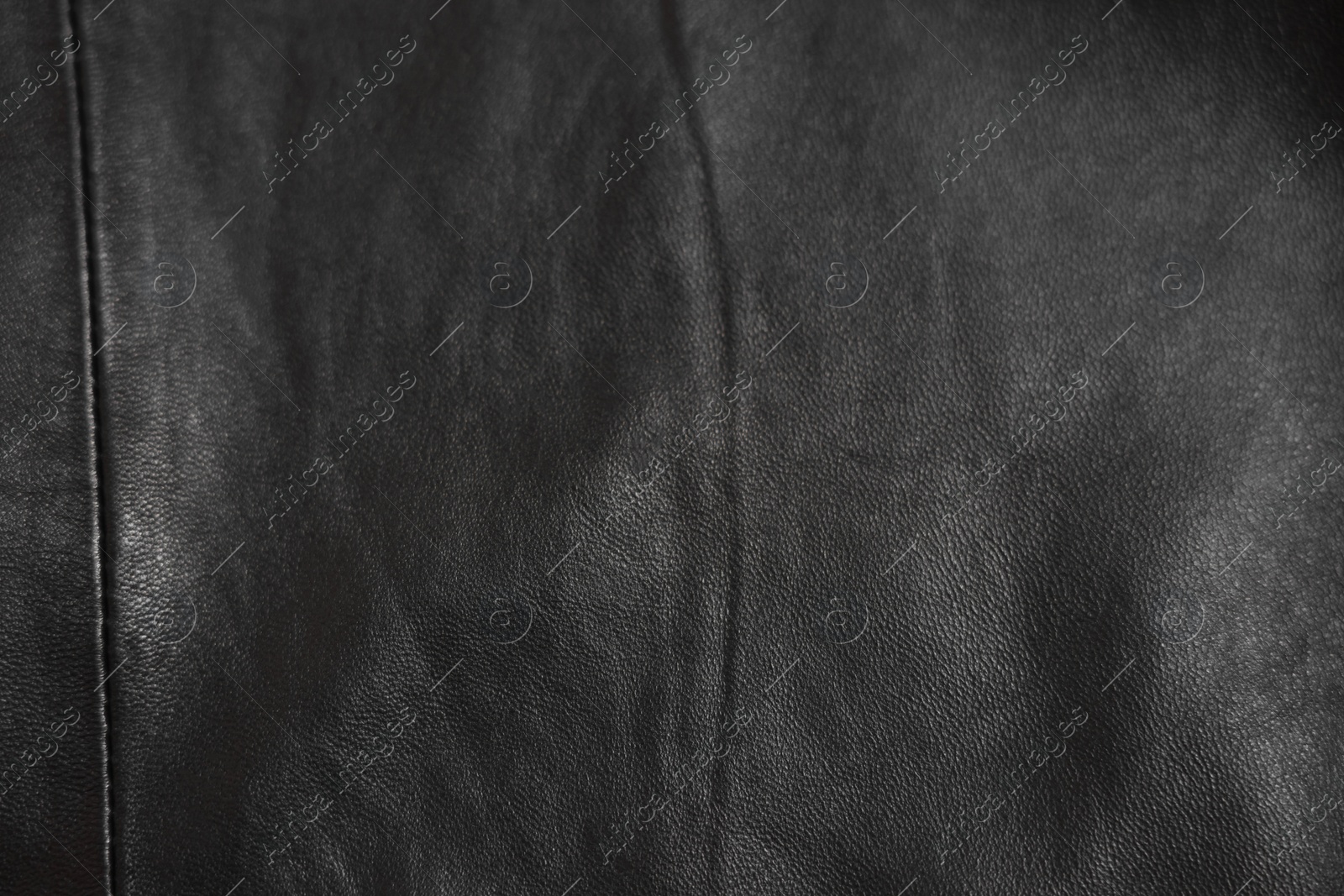 Photo of Texture of black leather as background, top view