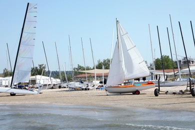 Seacoast with modern boats on sunny day