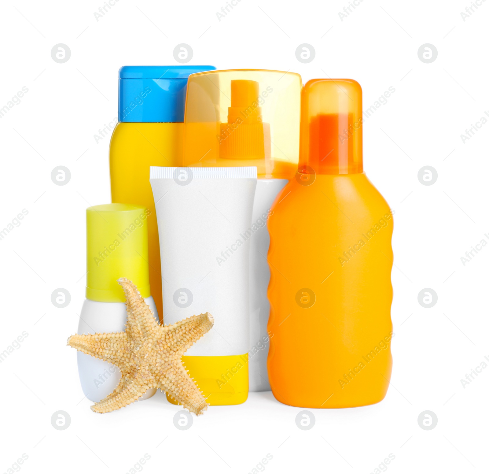 Photo of Different suntan products and starfish on white background