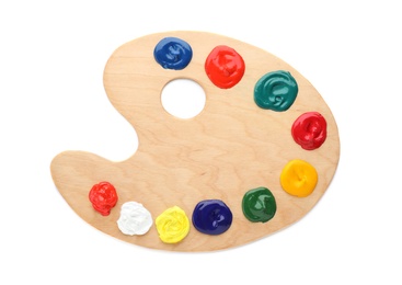 Wooden palette with colorful paints on white background, top view