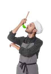 Professional chef with ladle on white background