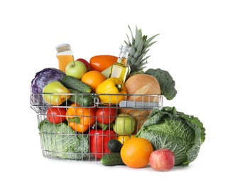 Shopping basket and grocery products on white background