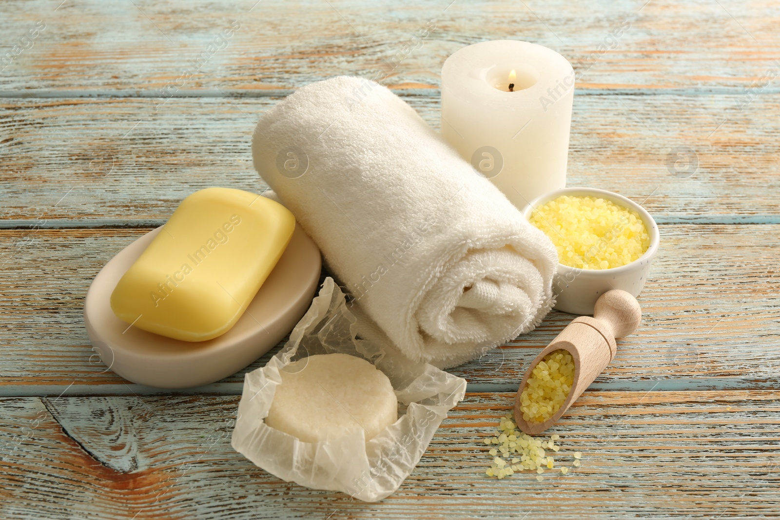 Photo of Composition with yellow sea salt on rustic table