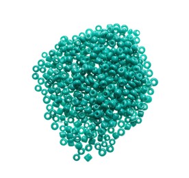 Photo of Pile of turquoise beads on white background, top view