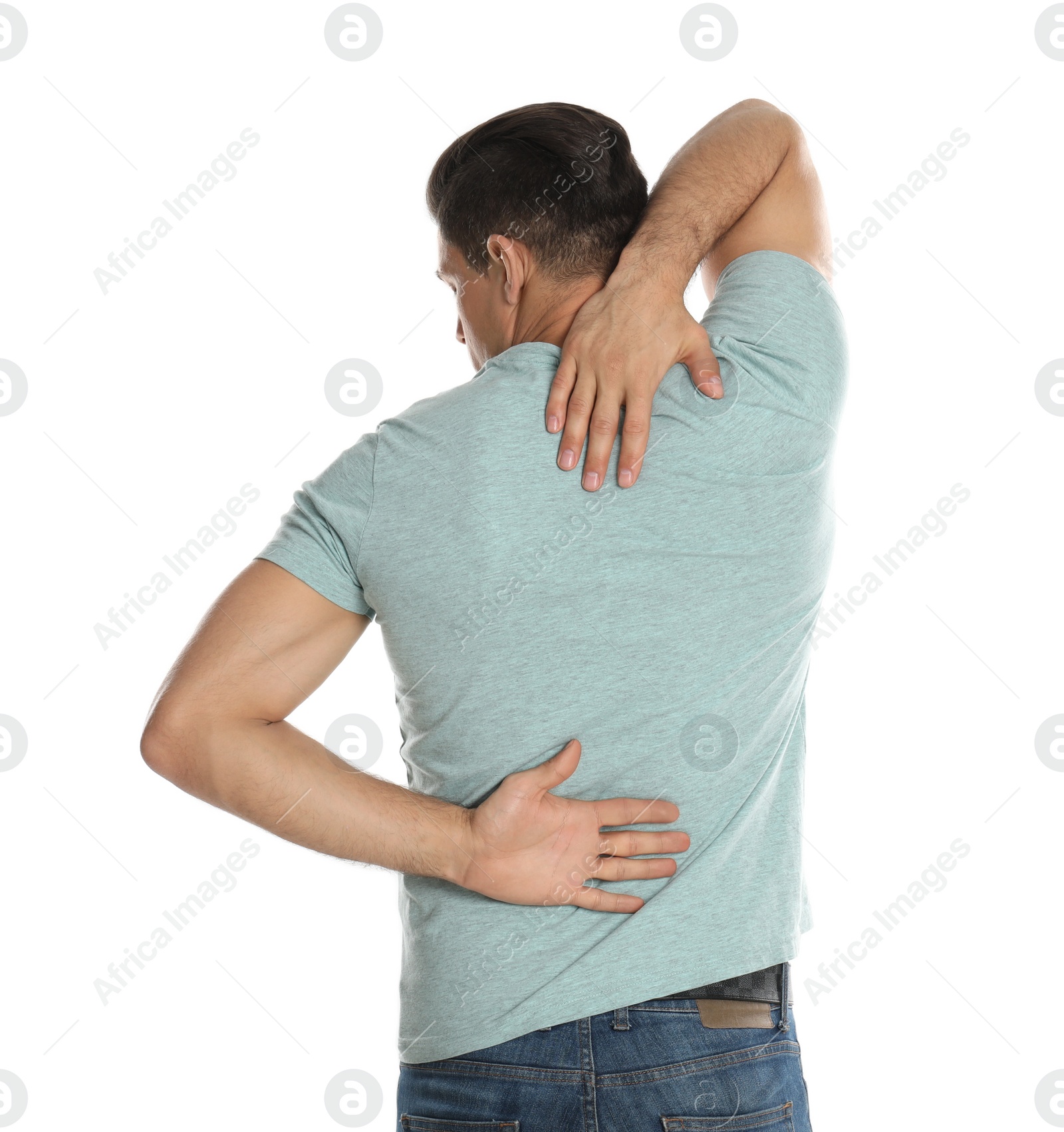 Photo of Man suffering from pain in back on white background. Visiting orthopedist