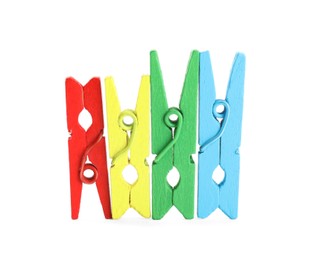 Photo of Many colorful wooden clothespins on white background