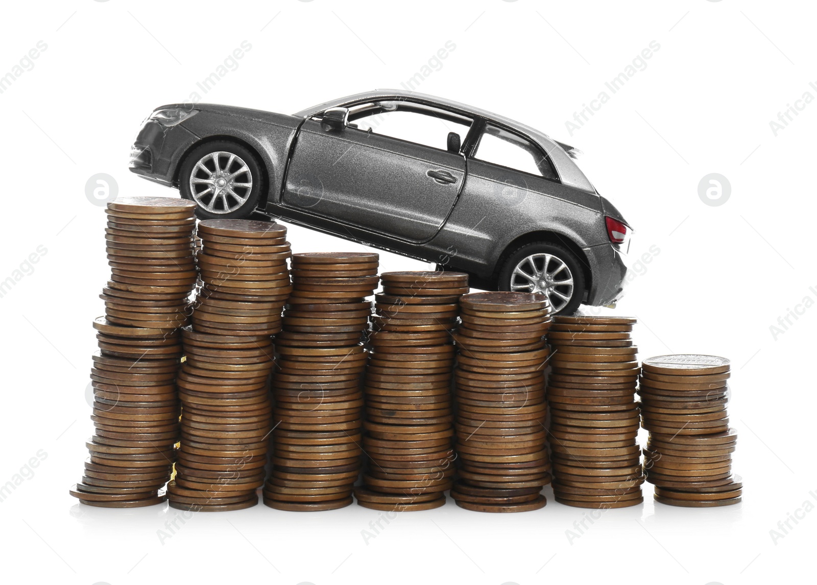 Photo of Miniature automobile model and money on white background. Car buying