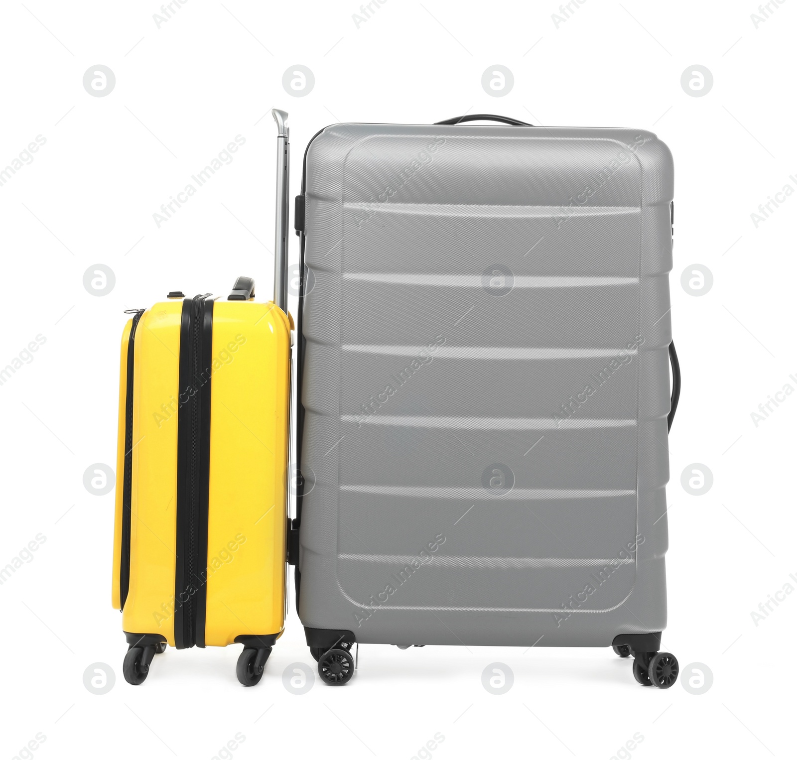 Photo of New suitcases packed for journey on white background