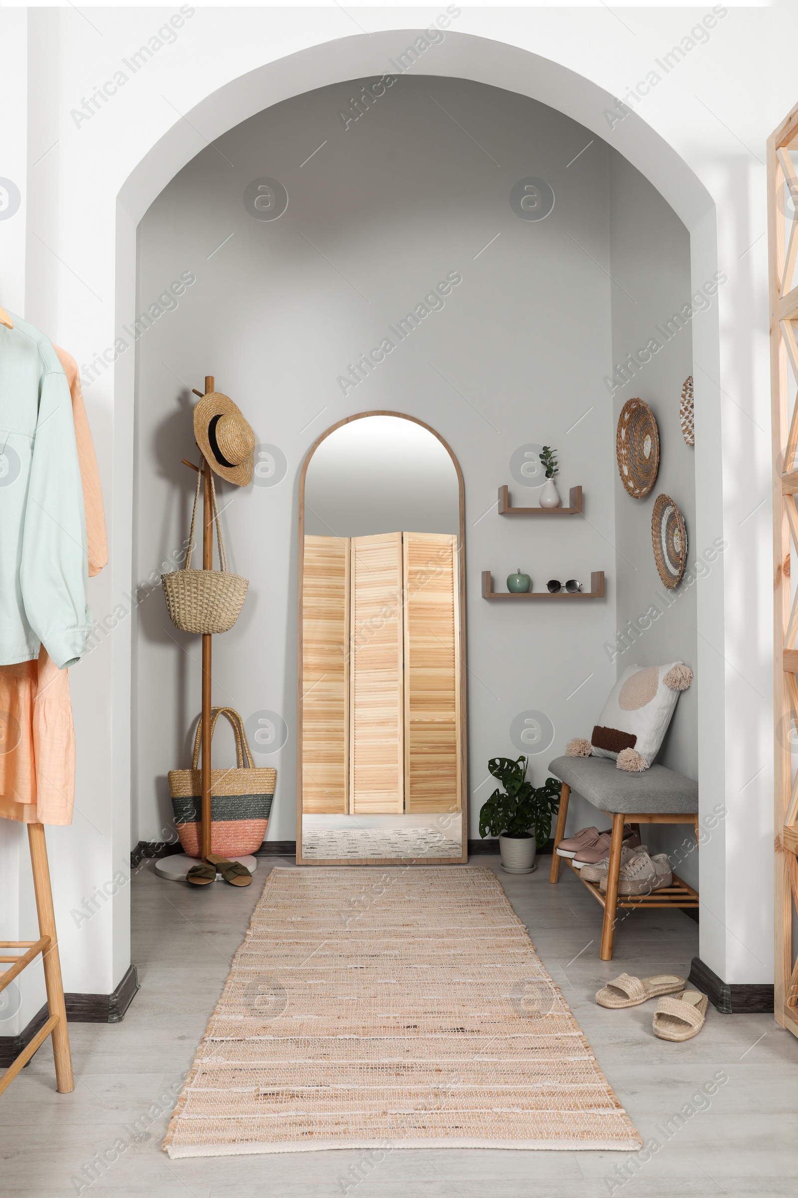 Photo of Hallway interior with stylish furniture and floor mirror