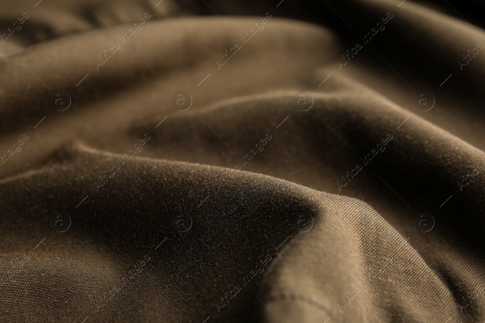 Photo of Texture of beautiful brown fabric as background, closeup