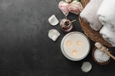 Photo of Flat lay composition with different spa products and rose flowers on grey table. Space for text