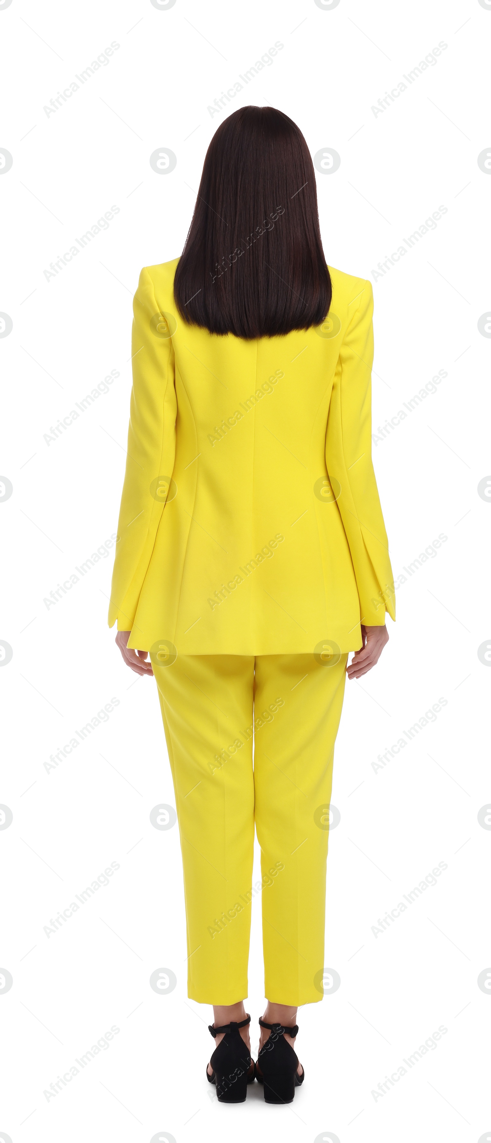 Photo of Businesswoman in yellow suit on white background, back view