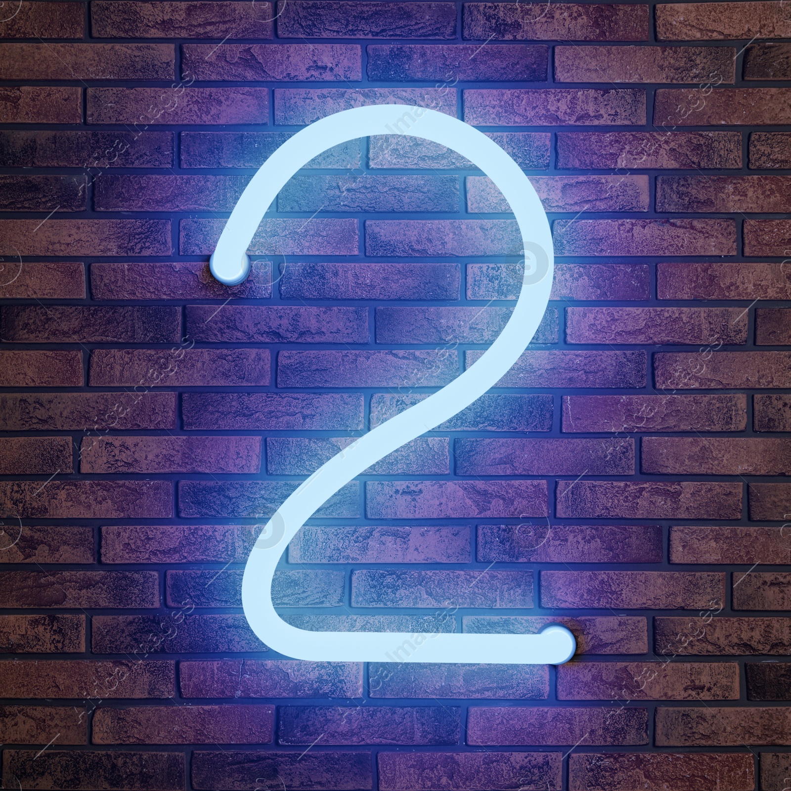 Image of Glowing neon number 2 sign on brick wall