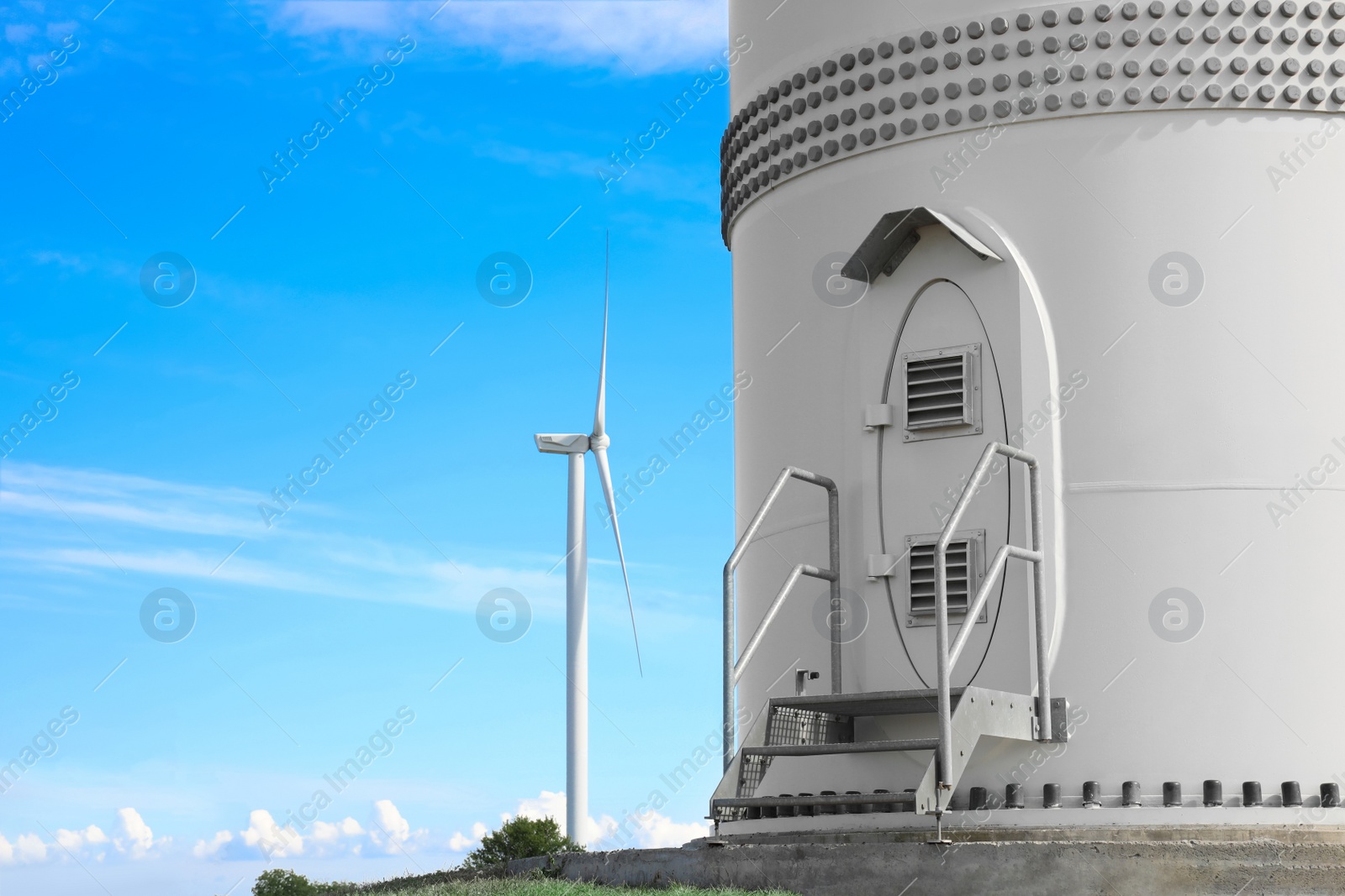 Photo of Entrance to wind turbine power generator outdoors. Alternative energy source