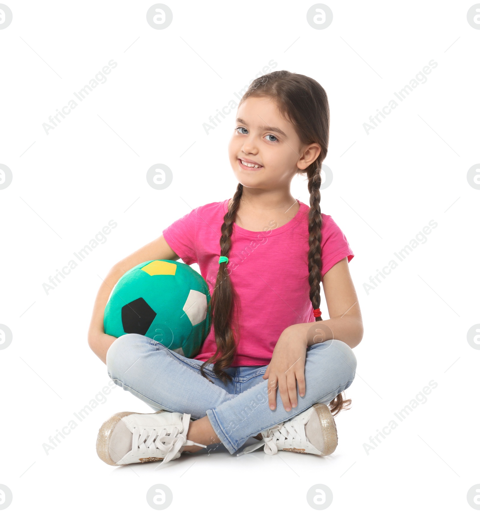 Photo of Cute little child with soft soccer ball on white background. Playing indoors