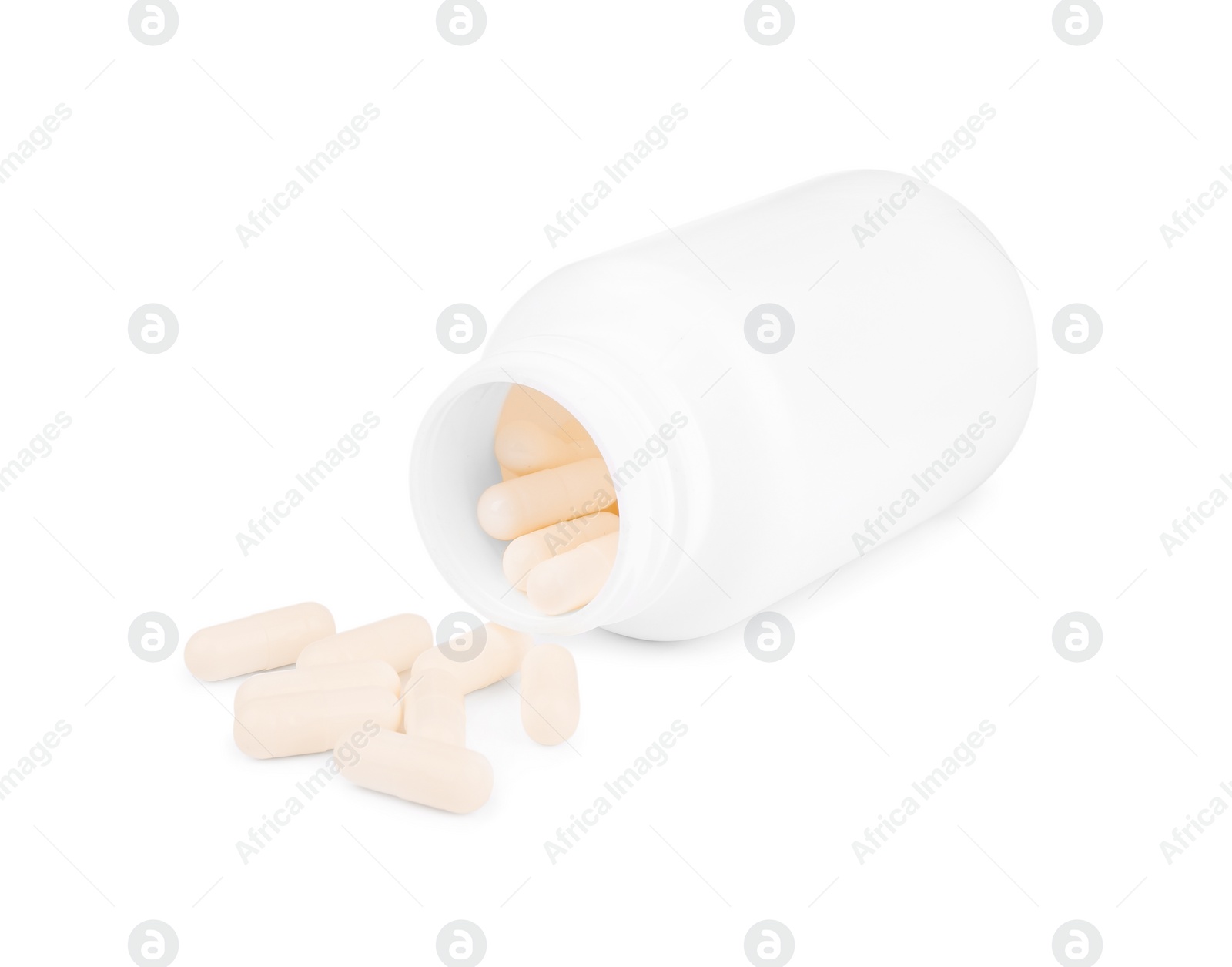 Photo of Vitamin capsules and medical bottle isolated on white