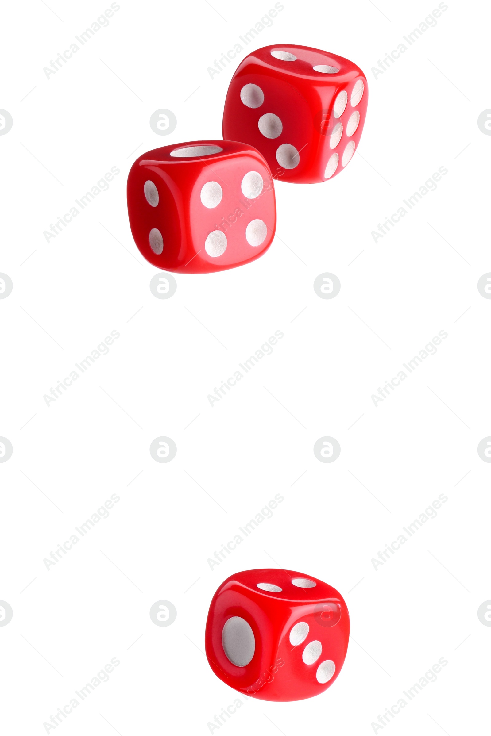 Image of Three red dice in air on white background
