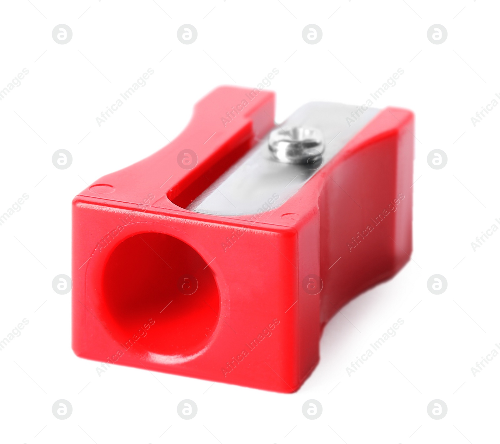 Image of Bright red pencil sharpener isolated on white. School stationery