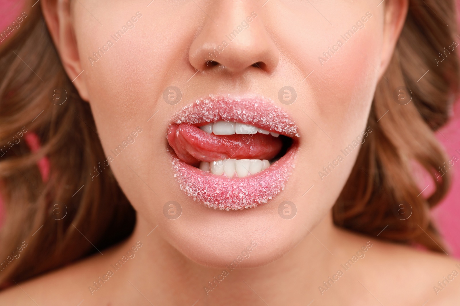 Photo of Beautiful young woman with sugar lips, closeup