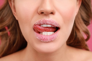Photo of Beautiful young woman with sugar lips, closeup