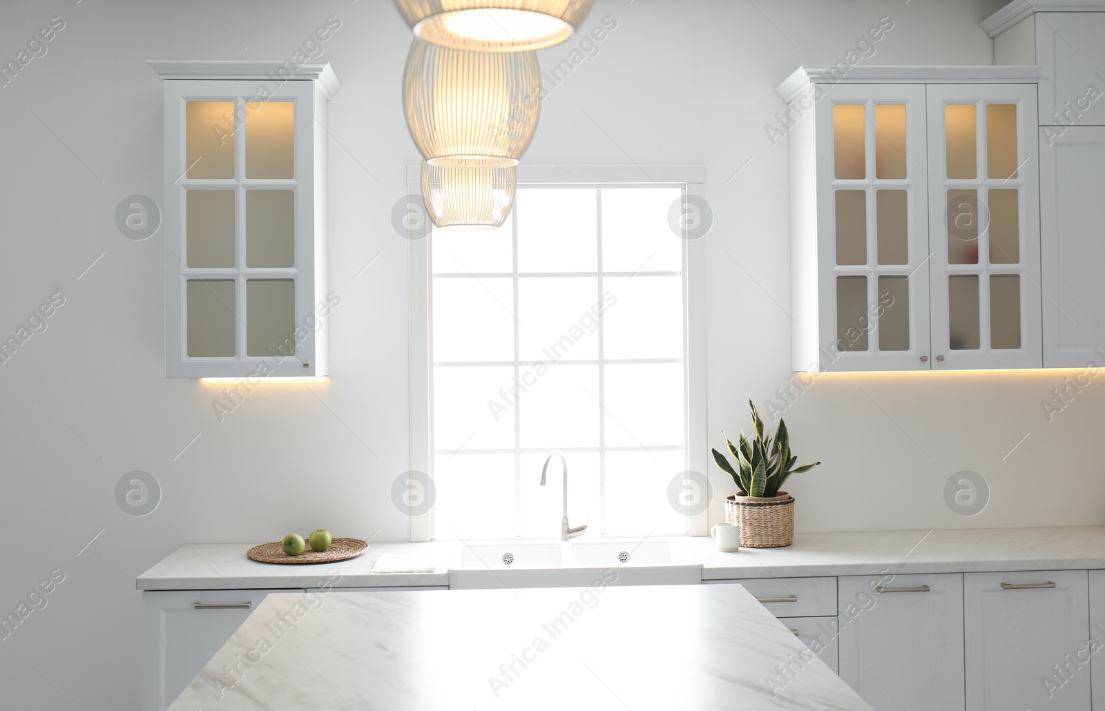 Photo of New ceramic sink and modern tap in stylish kitchen interior