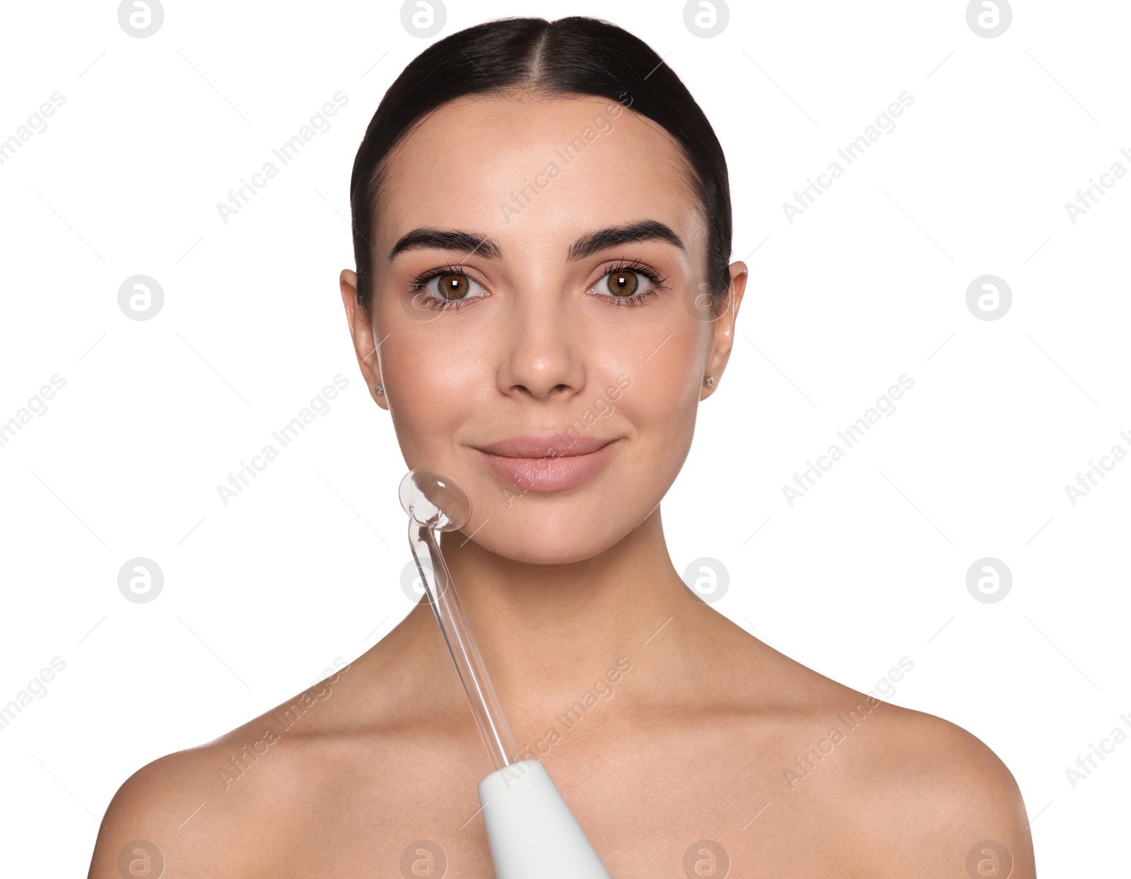 Photo of Woman using high frequency darsonval device on white background