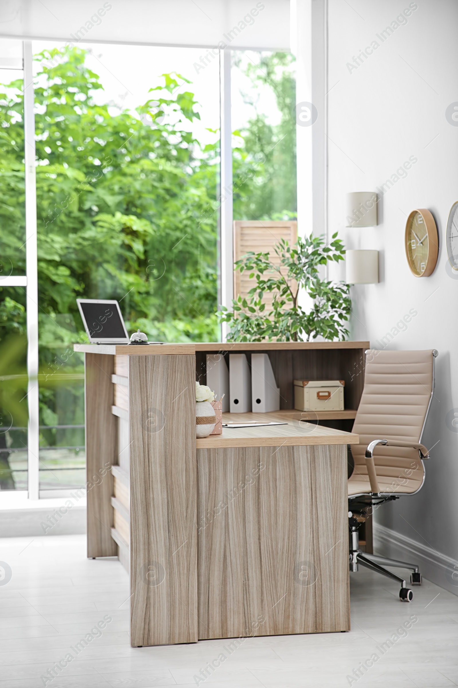 Photo of Receptionist desk in hotel. Workplace interior