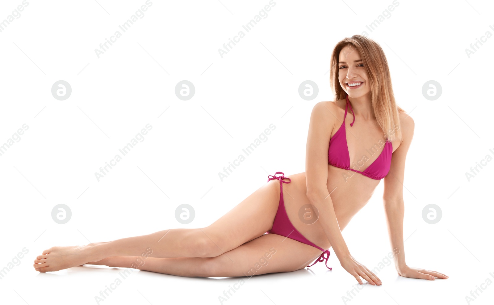 Photo of Young slim woman in bikini on white background. Perfect body