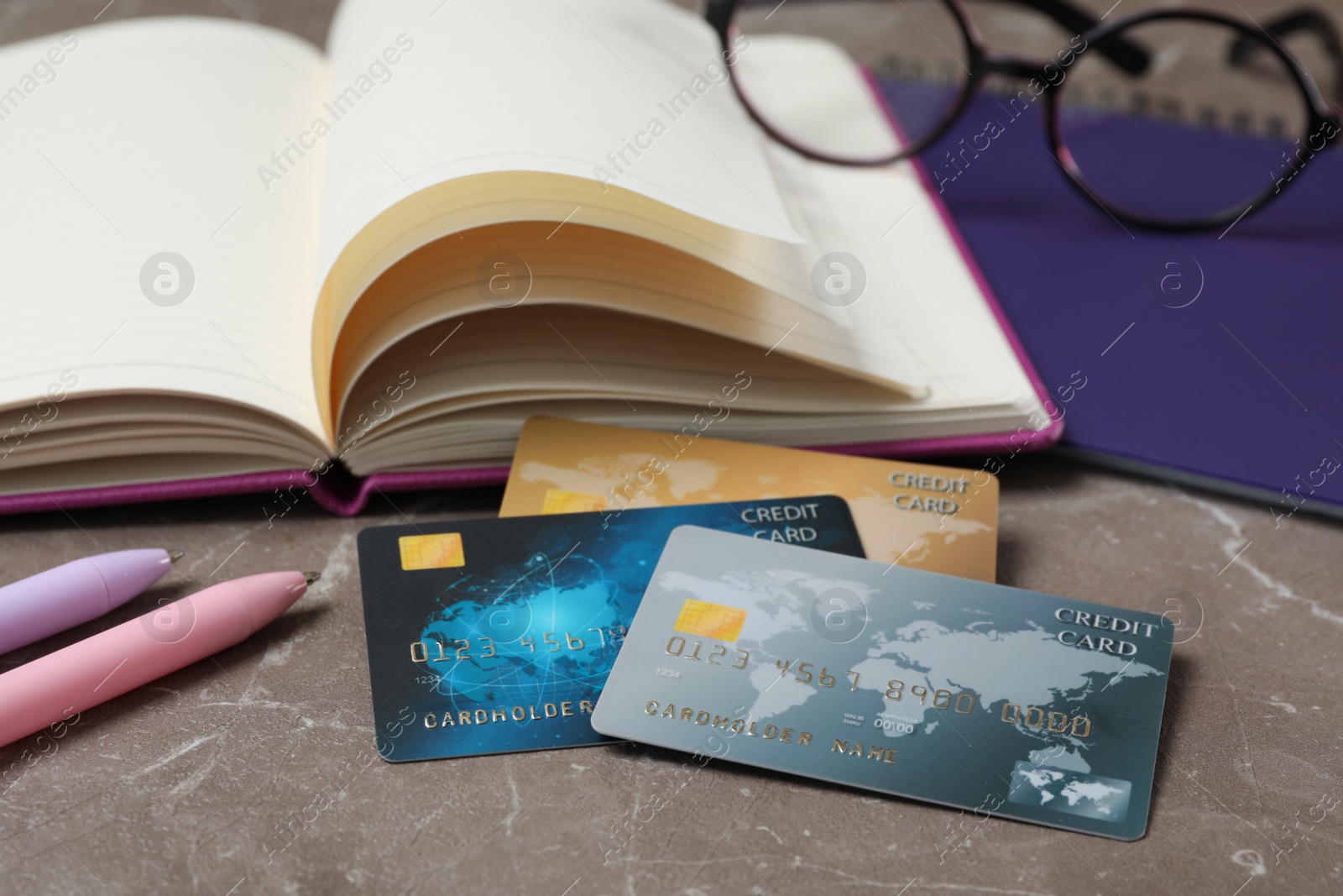 Photo of Credit cards and stationery on marble table