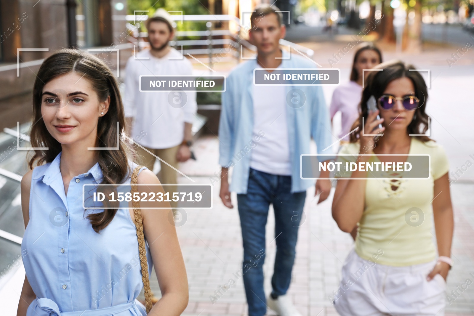 Image of Facial recognition system identifying people on city street. Woman and her personal data