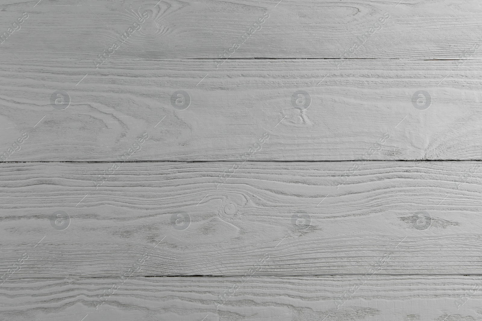 Photo of Texture of light grey wooden surface as background, closeup