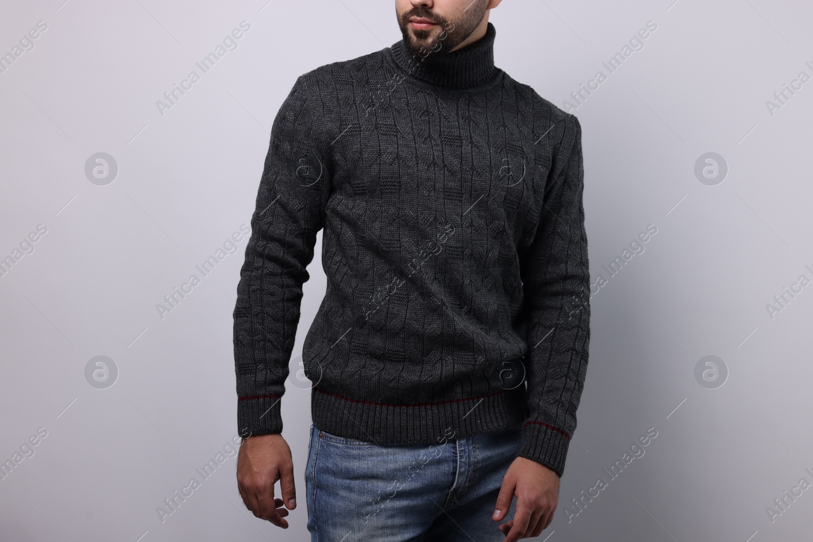 Photo of Man in stylish sweater on white background, closeup
