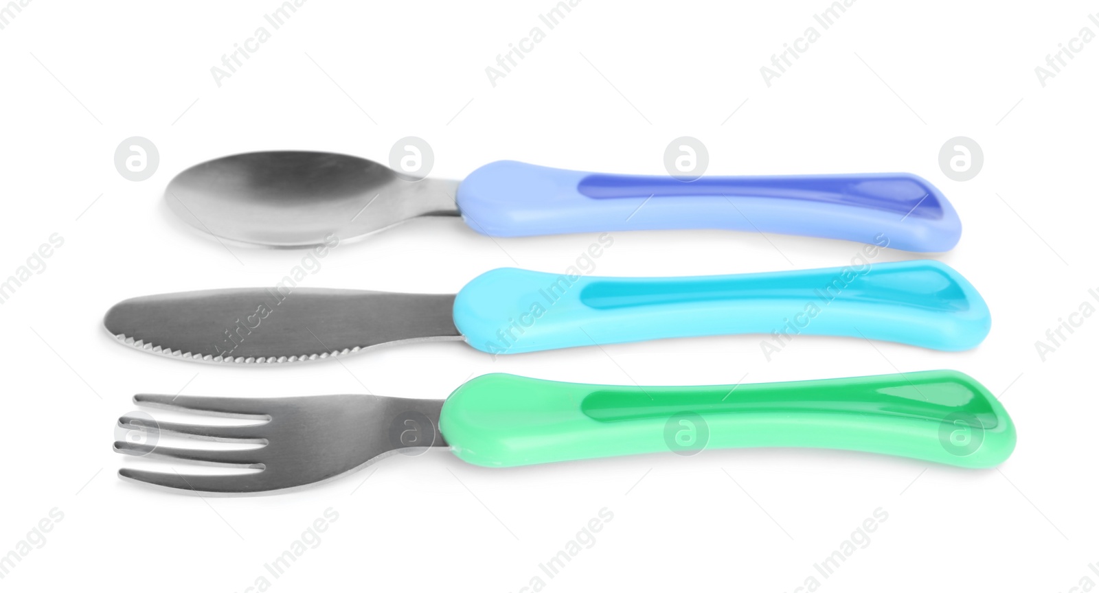 Photo of Set of small cutlery isolated on white. Serving baby food