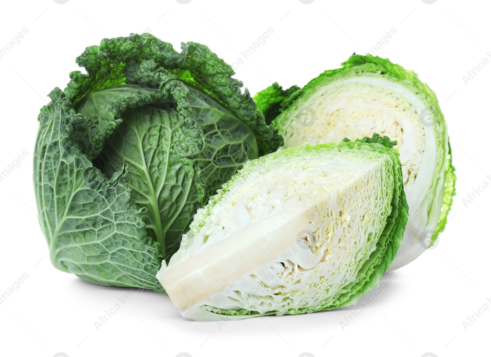 Photo of Whole and cut fresh savoy cabbages on white background